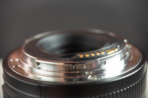 Close-up photo of a photographers camera lens on a black background