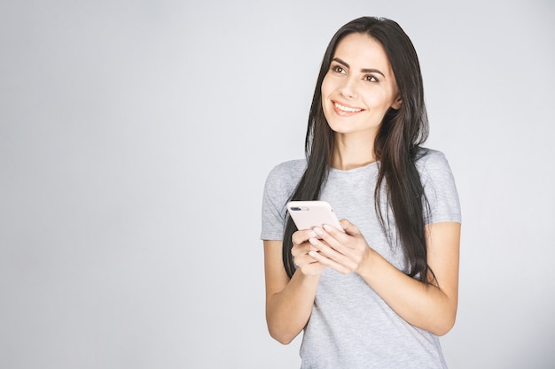 Close up photo portrait of cheerful lady using holding smartphone in hand