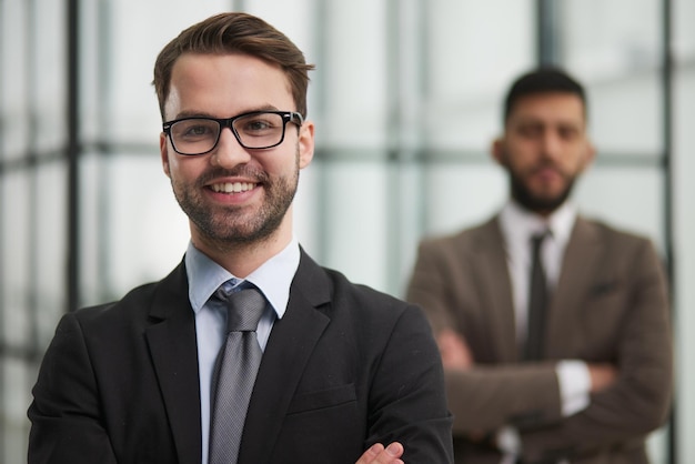 Close up photo portrait of successful and happy businessman working in modern office building senior investor