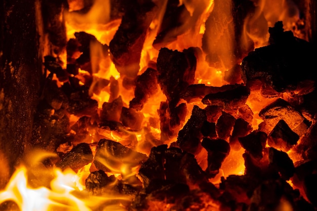Close up photo on red coals in burning bonfire