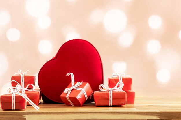 Close up photo of red gift boxes with hearth shaped box