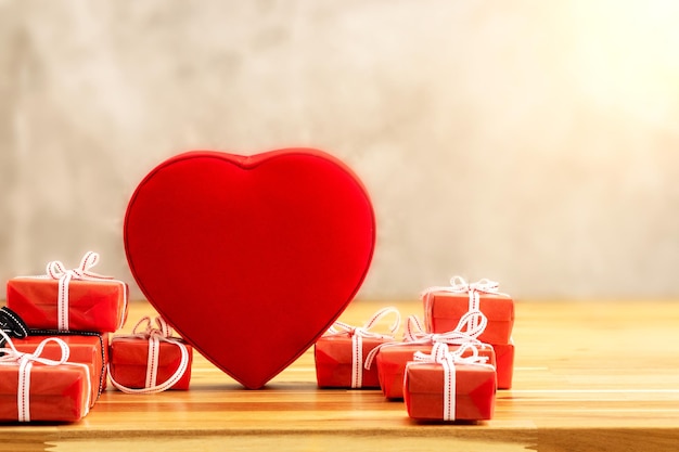 Close up photo of red gift boxes with hearth shaped box