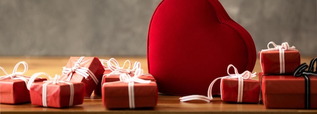 Close up photo of red gift boxes with hearth shaped box