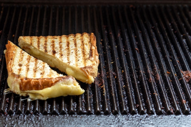 Close up photo of toast and sandwiches on grill