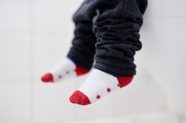 Close-up photo of toddler boy trainig use toilet