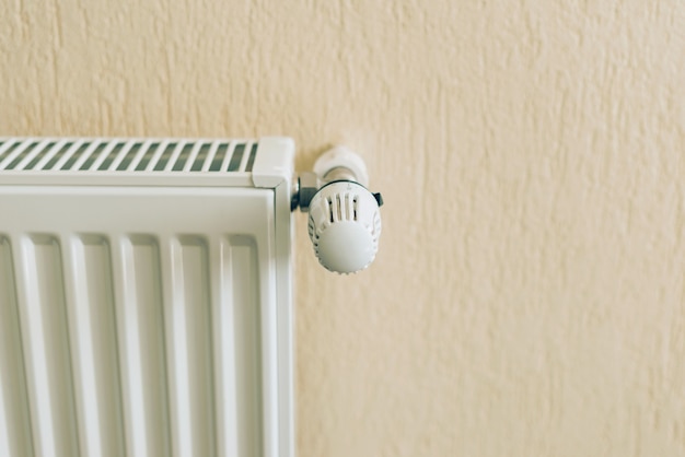 Close up photo of white radiator in living room. Ready for winter season