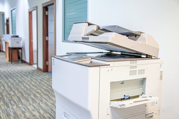 Close-up photocopier or printer is office worker tool equipment for scanning and copy paper.