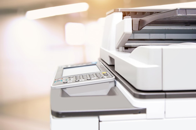 Close up the photocopier with office workplace background