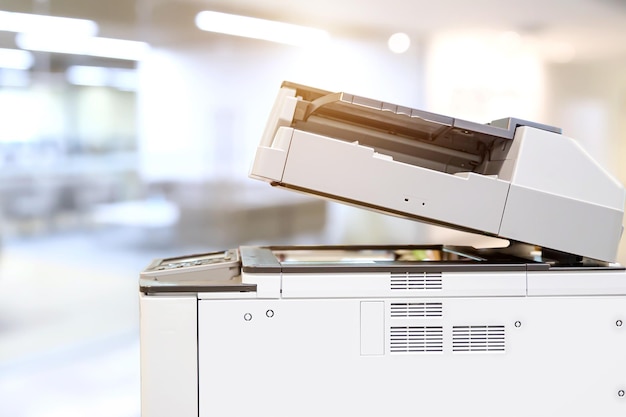 Photo close up the photocopier with office workplace background