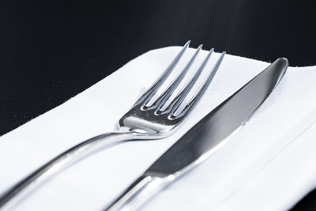 Photo close-up of piano on table against black background