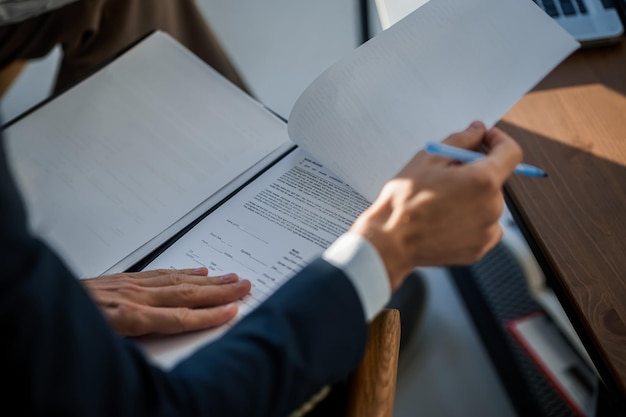 Close up pictture of a mans hands with papers