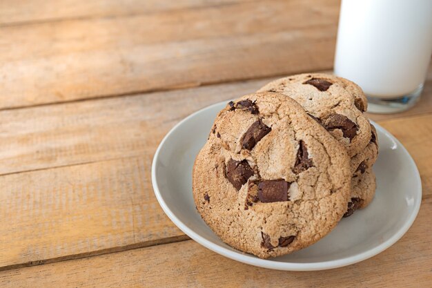 Close up picture of chocolate cookies and milk