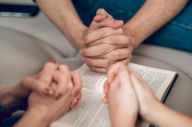 Close up picture of hands while praying