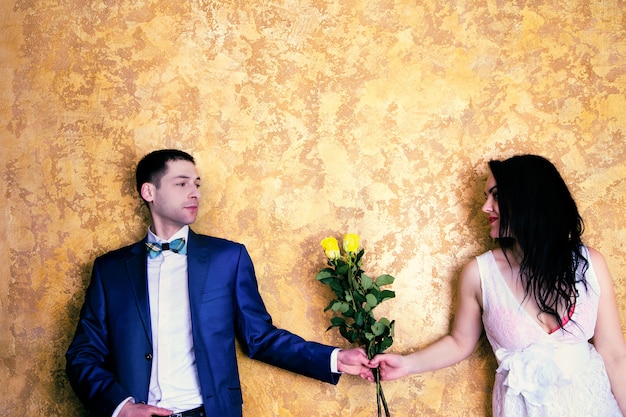 Close up picture of a happy couple with flowers