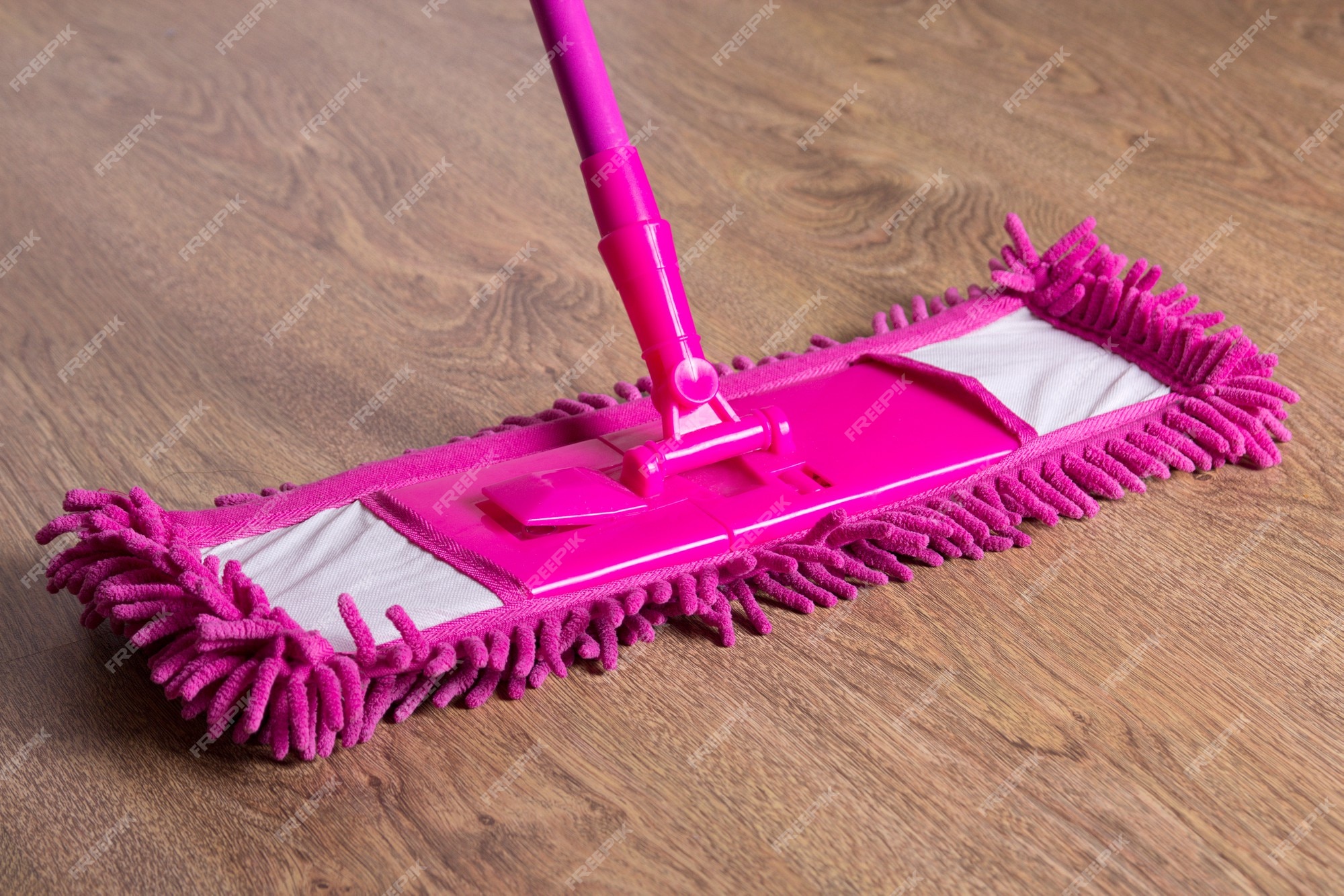 Premium Photo  Close up picture of wooden floor with pink cleaning mop