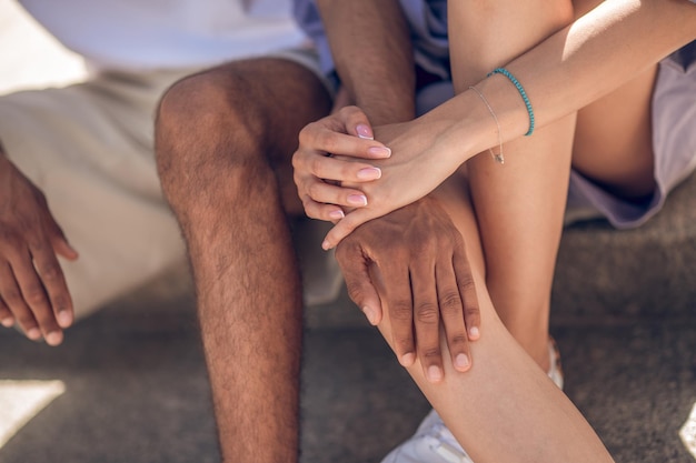 Close up picture of young people sitting close