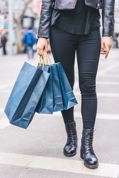 Close up picture young woman holding a shopping bag