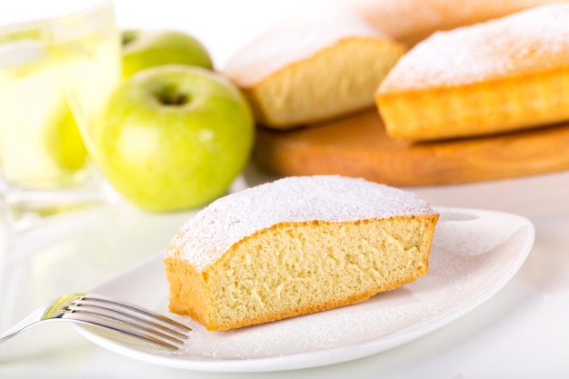 close up of piece of cake with icing sugar