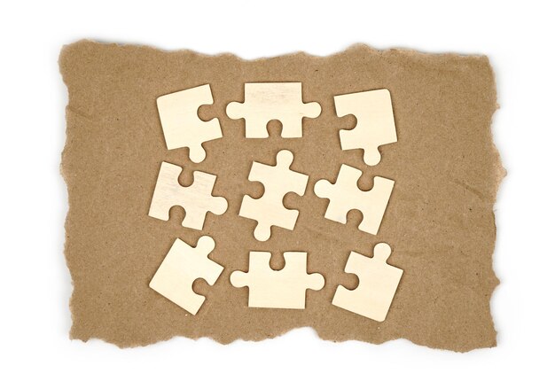 Photo close up piece of white jigsaw puzzle  concept of business challenge completion with teamwork