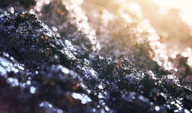 A close up of a pile of black rocks with the word'black'on it