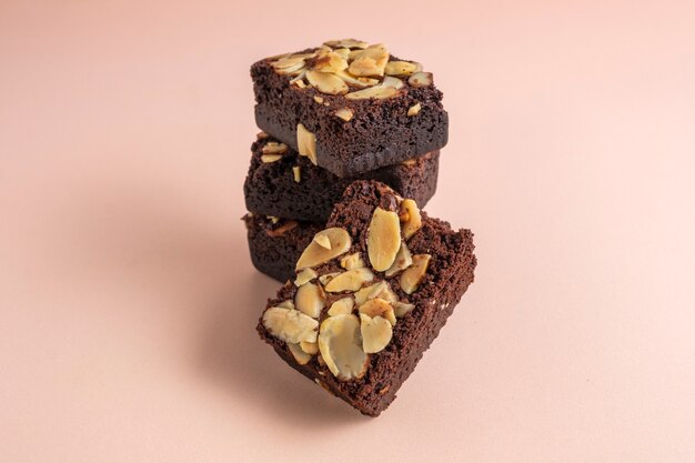 Photo close up on pile of fleshly baked almond brownies