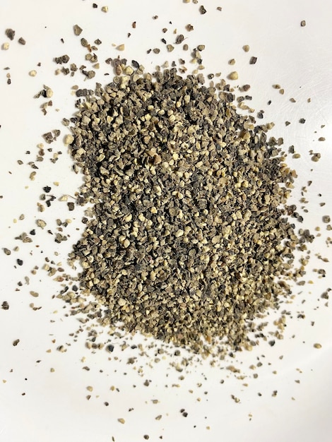 A close up of a pile of seeds on a white bowl