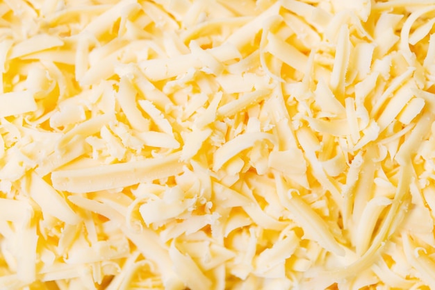 Photo a close up of a pile of shredded cheese