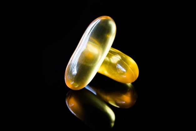 Photo close-up of pills against black background