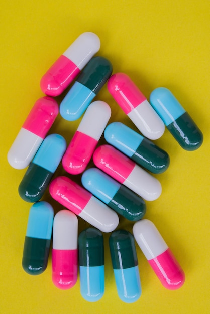 Close-up of pills against yellow background