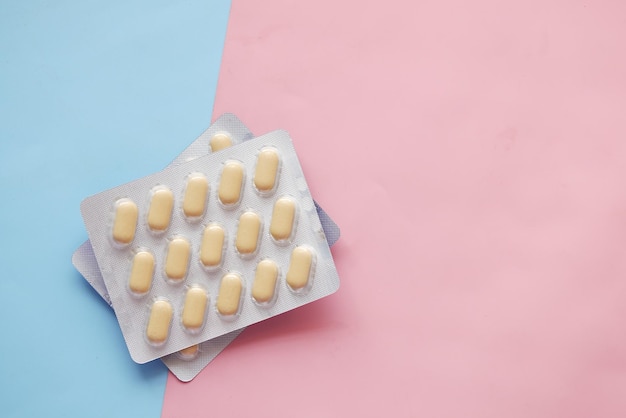 Close up of pills of blister pack on table