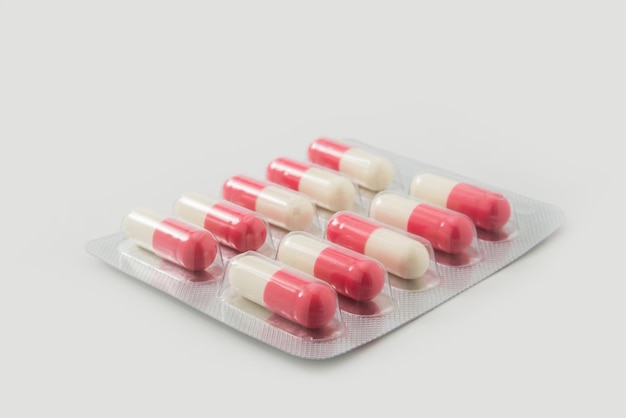 Close-up of pills over white background