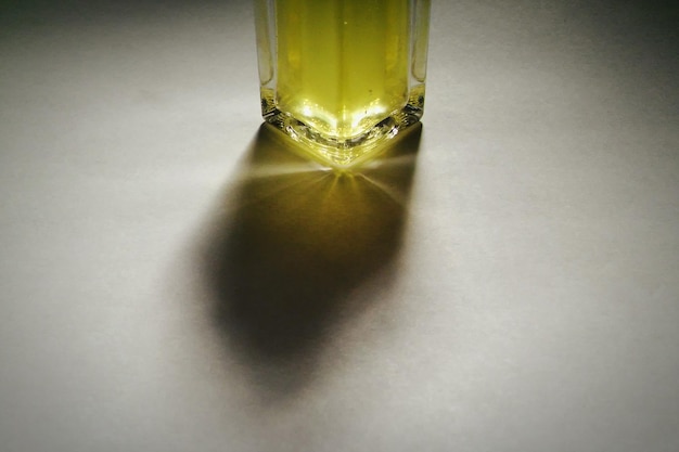 Close-up of pineapple juice in drinking glass on table