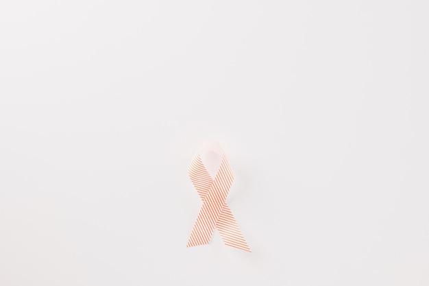 Close up pink awareness ribbon of International World Cancer Day