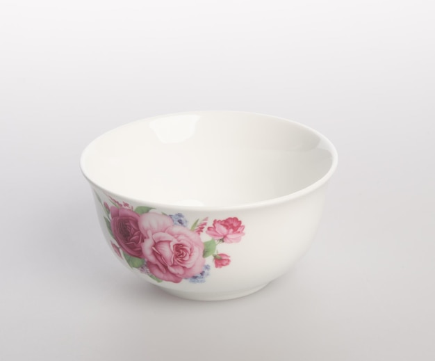 Photo close-up of pink flower in bowl against white background