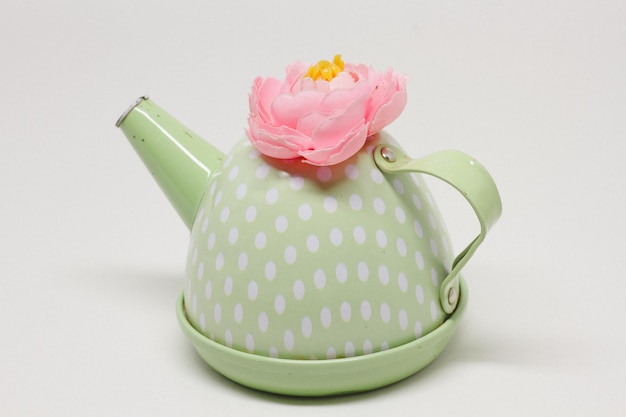 Close-up of pink flower on white table