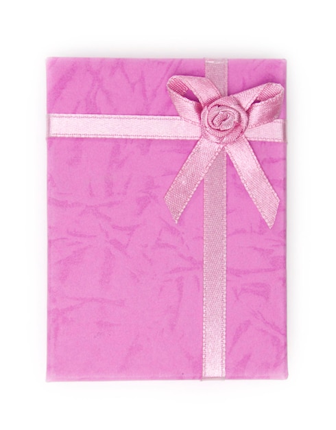 Photo close-up of pink gift box over white background