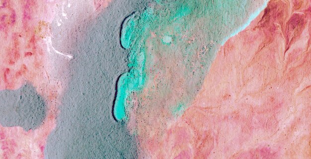 A close up of a pink and green painting with a blue background and the word love on it.