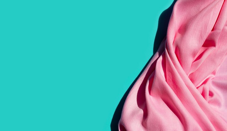Photo close-up of pink umbrella against blue background