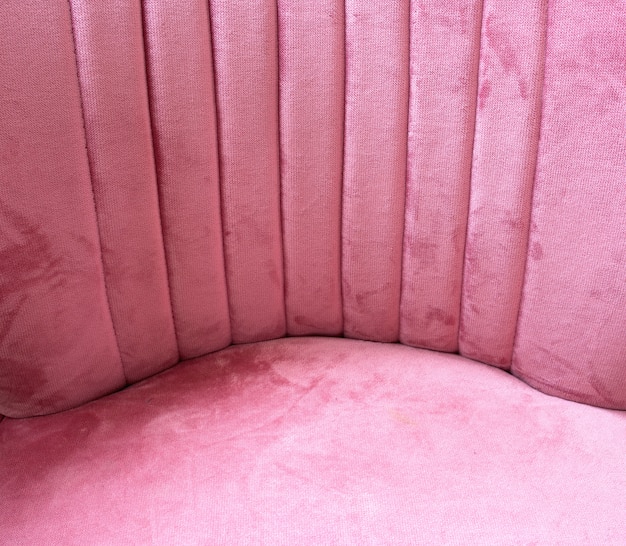 Close up of pink velvet fabric background texture, soft pastel pink textile