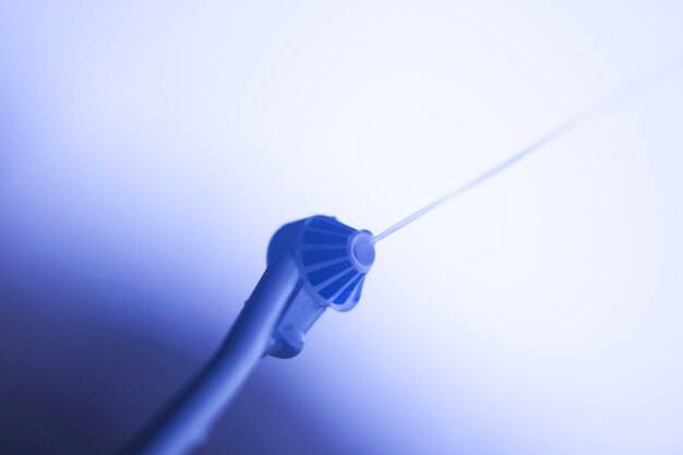 Close-up of pipe against blue background