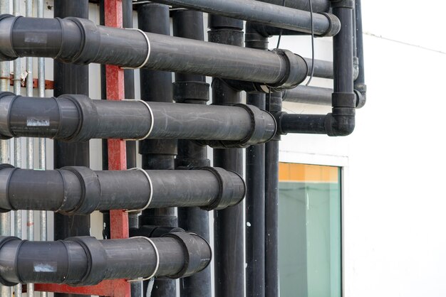 Photo close-up of pipes against building