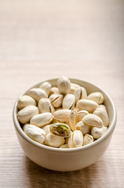 Close up Pistachios Nuts on wooden background