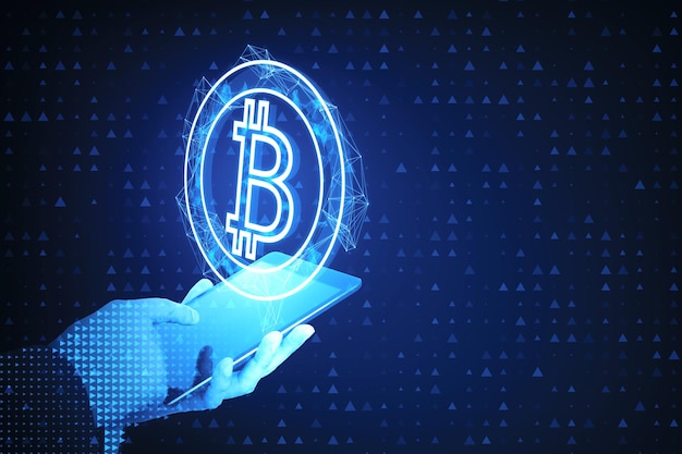 close up of pixel hand holding mobile phone with abstract bitcoin hologram on blue background cryptocurrency and finance concept