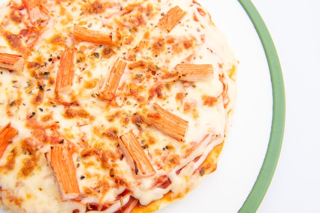 Close up of a Pizza in a cardboard box against on white background
Pizza delivery. Pizza menu.