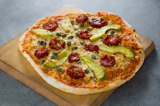 Close-up of pizza served on a pizza tray