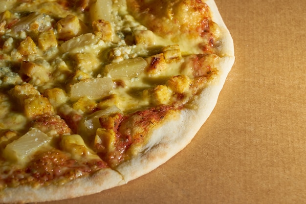 Close up of pizza with chicken and pineapple