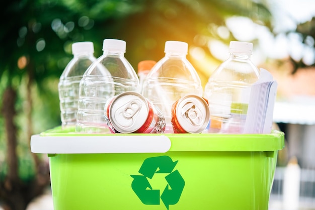Close-up of plastic bottles in garbage bin