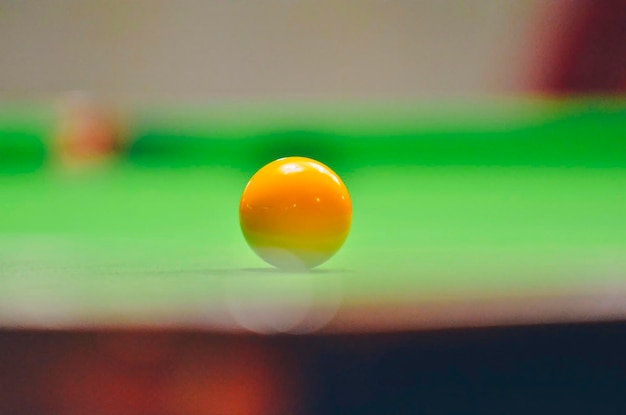 Close-up of pool ball on table