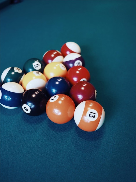 Close-up of pool balls arranged on table