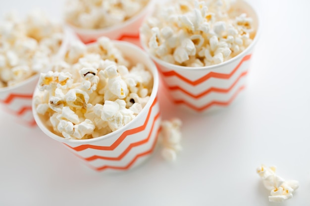 close up of popcorn in disposable paper cups